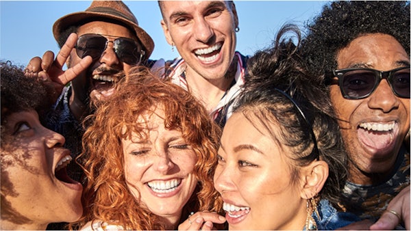 Six people smiling for a selfie