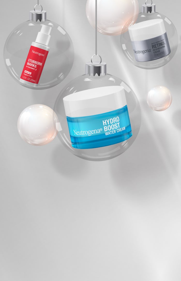 Productos de Neutrogena Stubborn Marks Retinol SA, Hydro Boost Water Cream y Retinol Cream dentro de adornos navideños